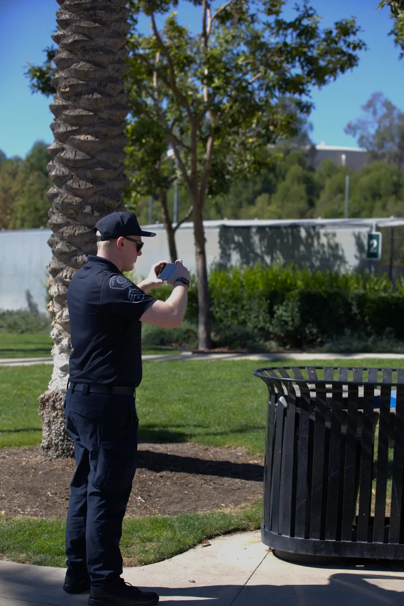 Officer photographing a finding on patrol for a time-stamped report