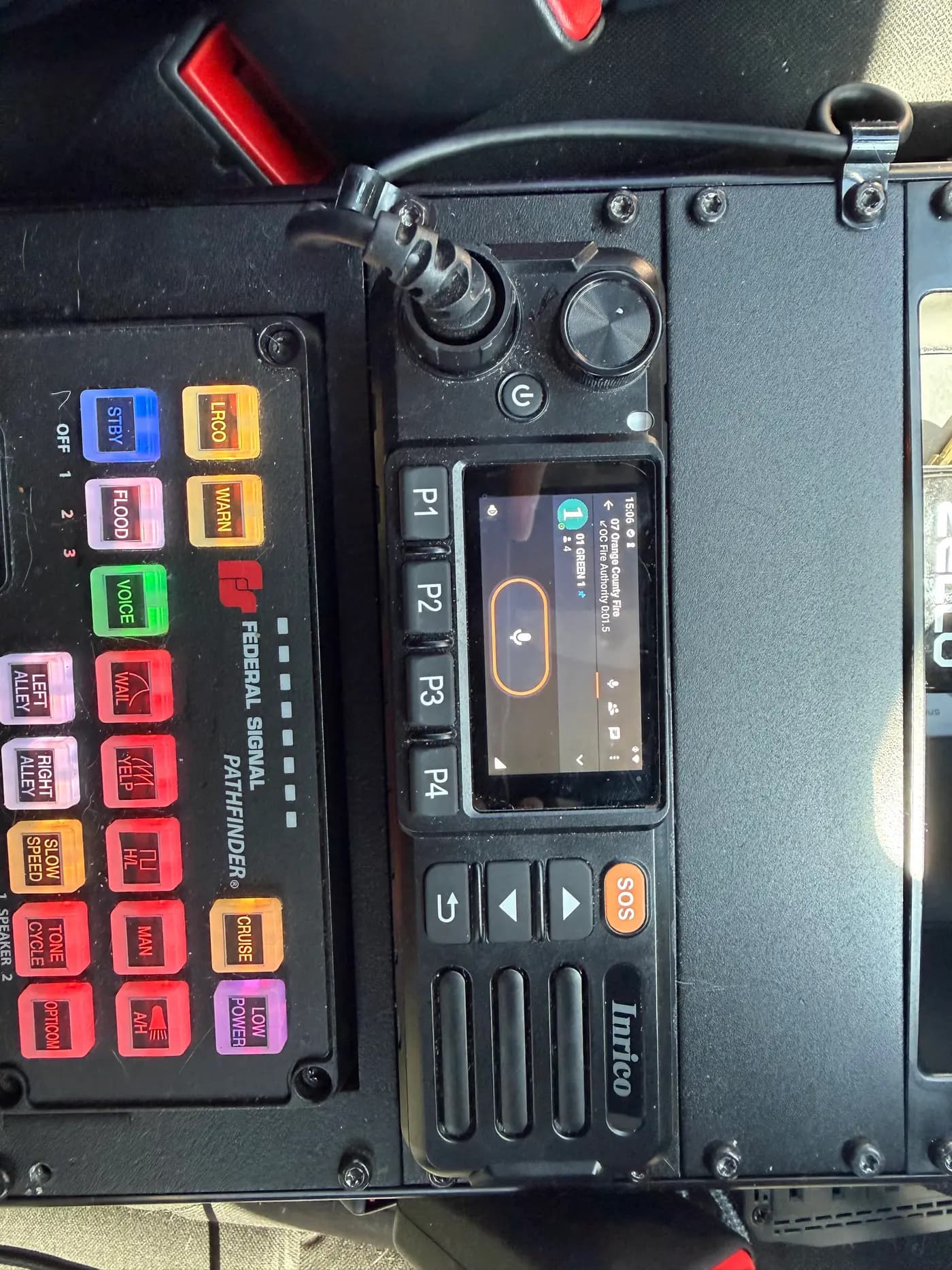 In-vehicle radio and siren controller with illuminated buttons