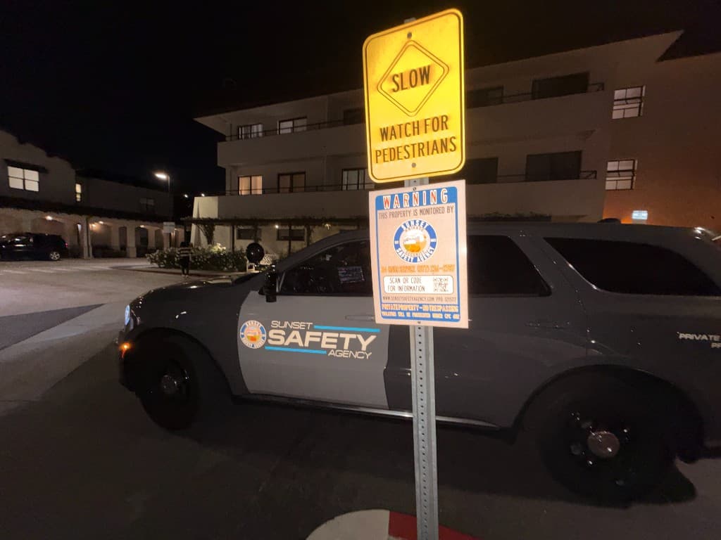 Sunset Safety Agency officer at community outreach event with residents
