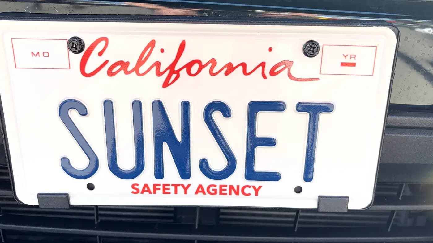 Close-up of the SUNSET vanity show plate on a patrol vehicle grille
