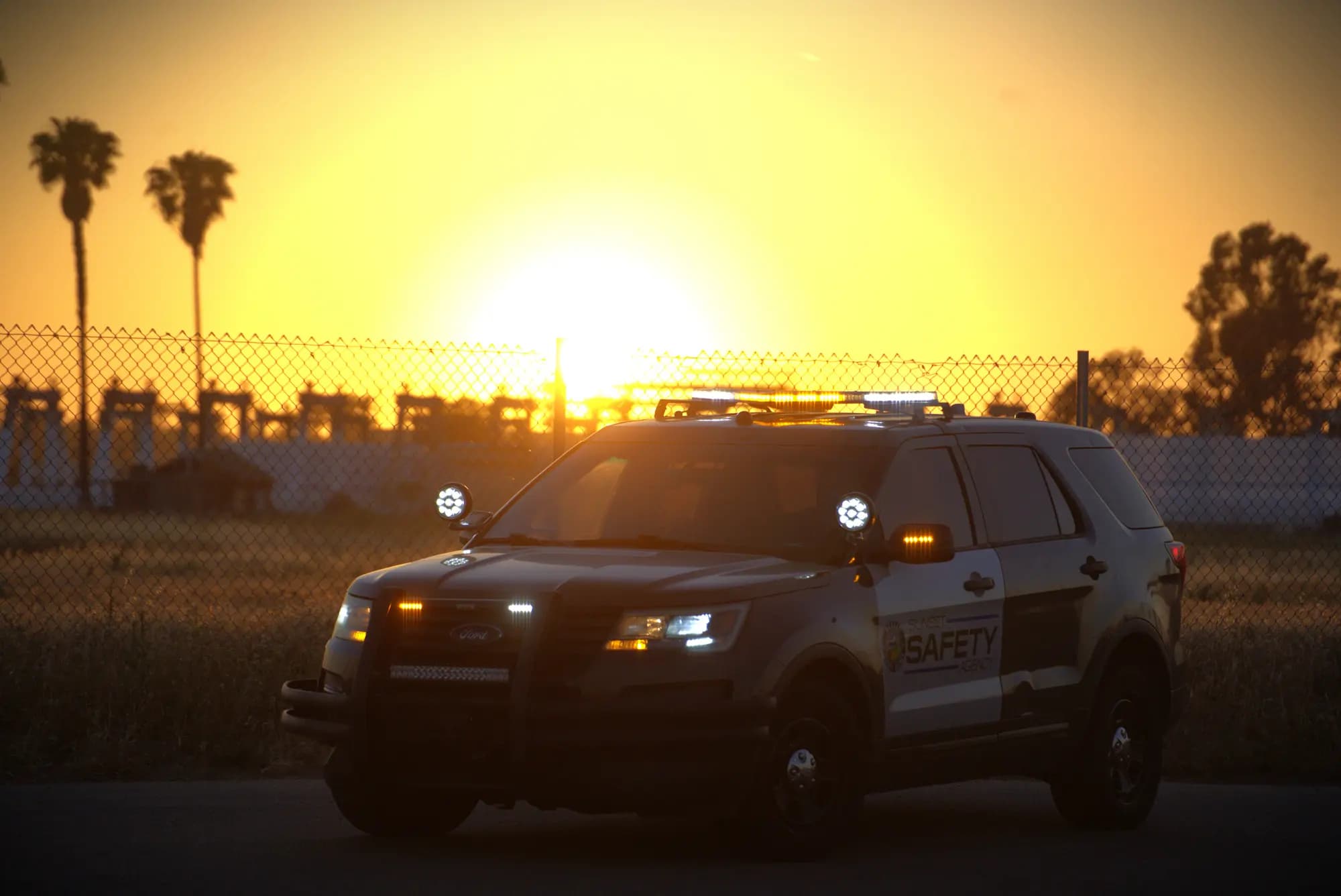Patrol Explorer silhouetted against a golden sunset, slow ambient zoom