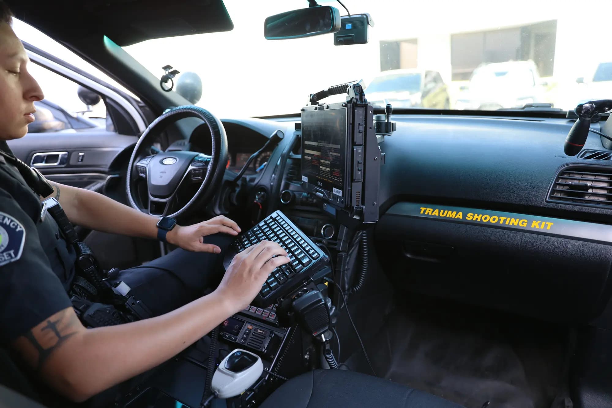Officer completing digital contract and post orders on a mobile data terminal