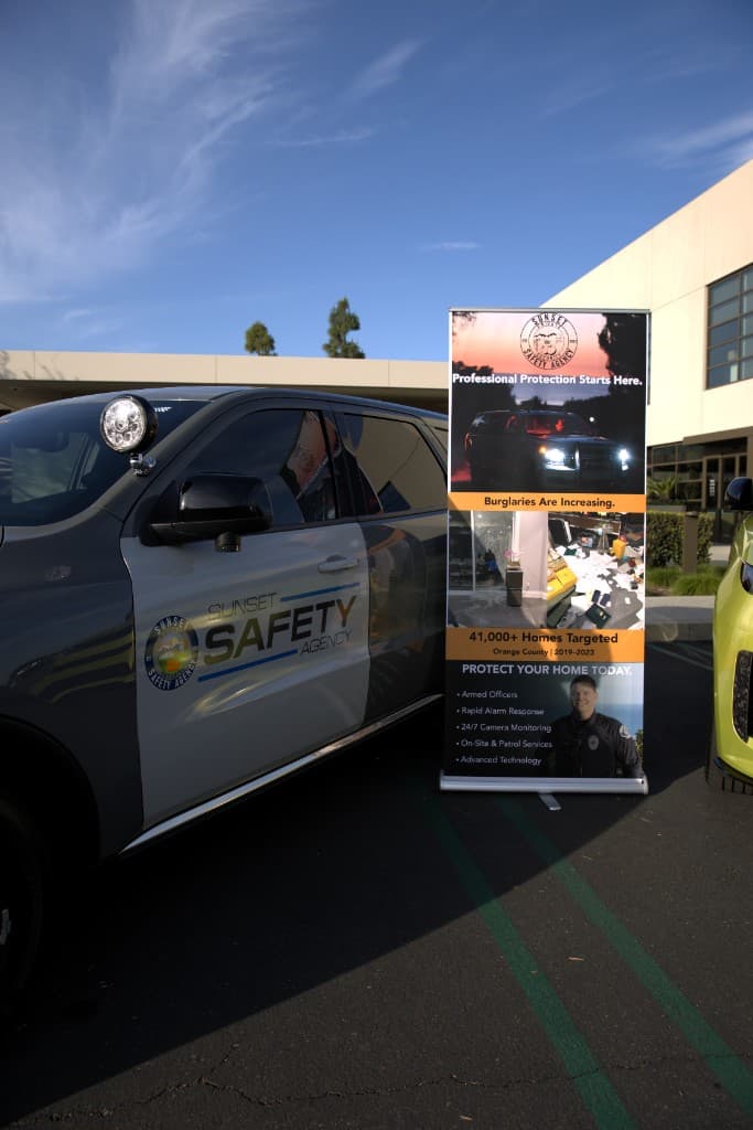 Promotional banner and patrol vehicle at outreach event