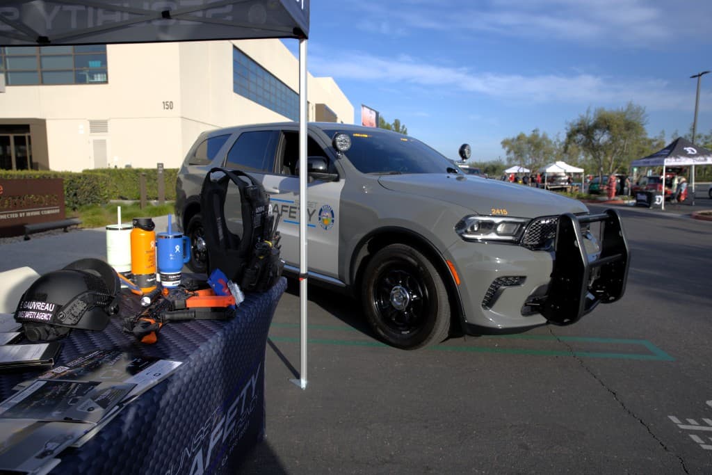 Event display with Sunset Safety Agency branded gear and helmet