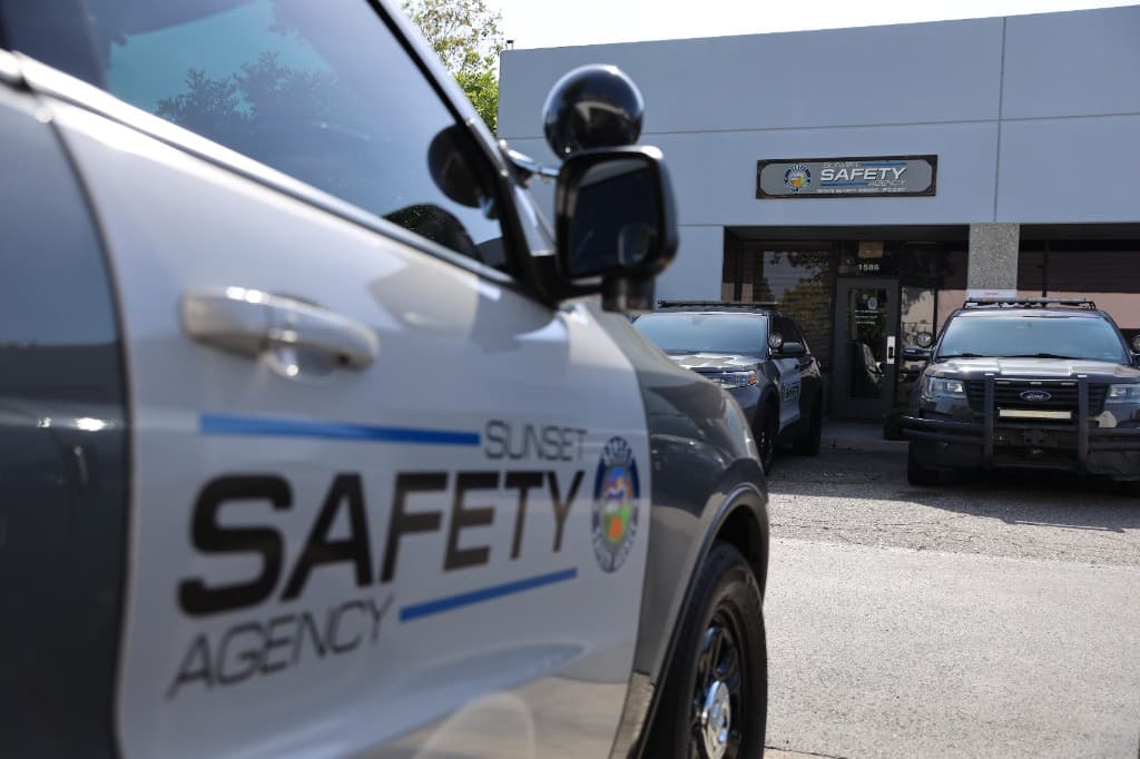 Close-up of Sunset Safety Agency vehicle door branding