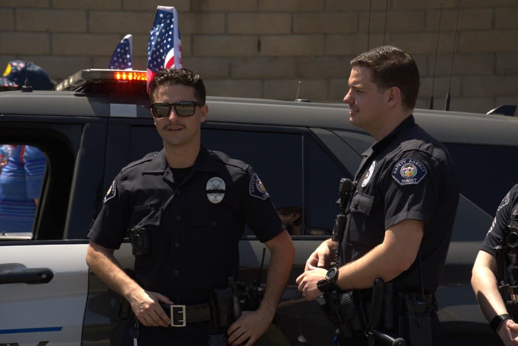 Sunset Safety Agency sergeant in uniform with body-worn camera outdoors