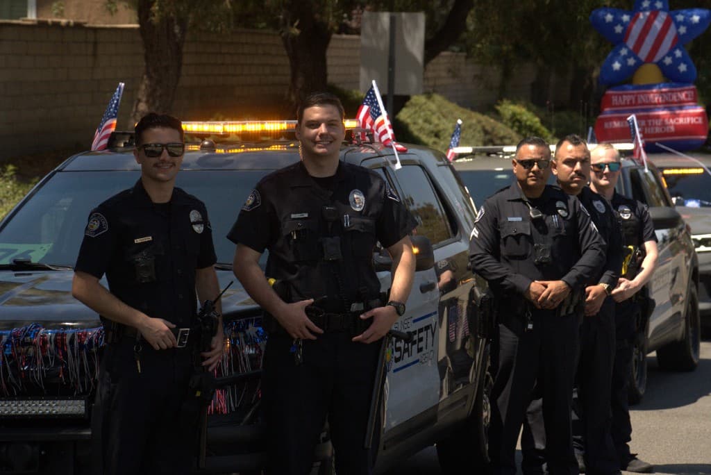 Sunset Safety Agency officers at Independence Day event with patriotic decorations