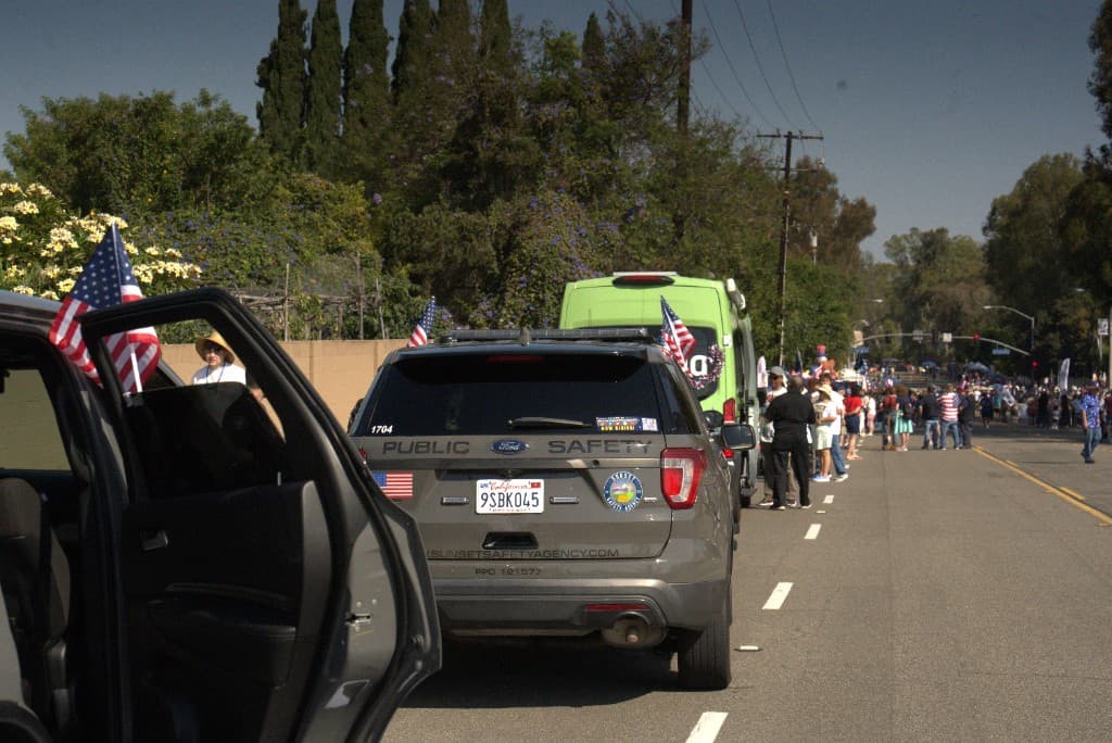 Lineup of Sunset Safety Agency officers with patriotic fleet decorations