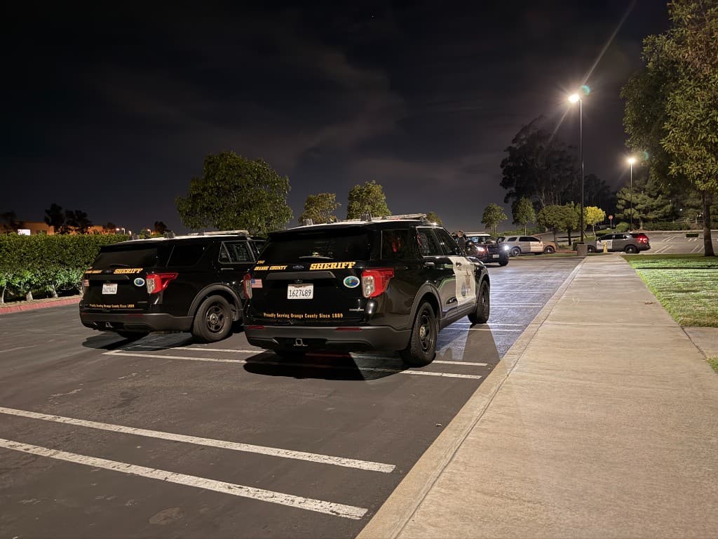 Marked patrol unit arriving on scene at night